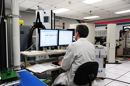 A scientist typing on a computer